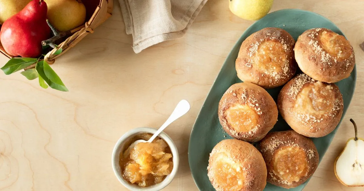 A plate displaying No Yeast Dinner Rolls with ripe pears and apples, highlighting a wholesome and visually appealing dish.